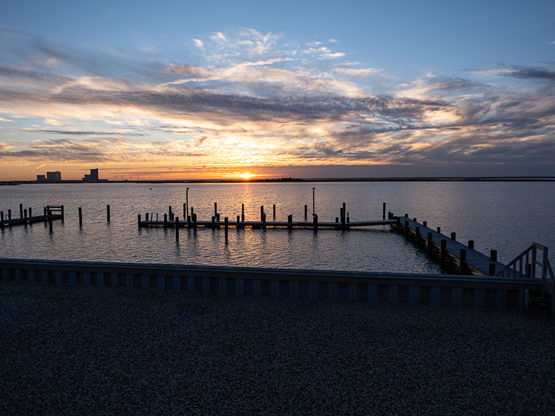 Sunset over a lake in front of docks